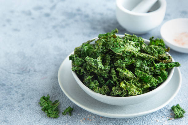 istock crispy kale chips in bowl, healthy vegan food 1314522691