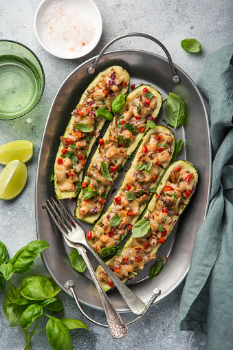 Stuffed zucchini boats with vegetables and cheese,  top view