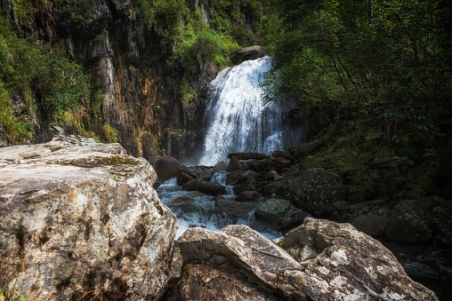 Korbu Waterfall at Lake Teletskoye in the Altai Mountains. The most famous lake waterfall