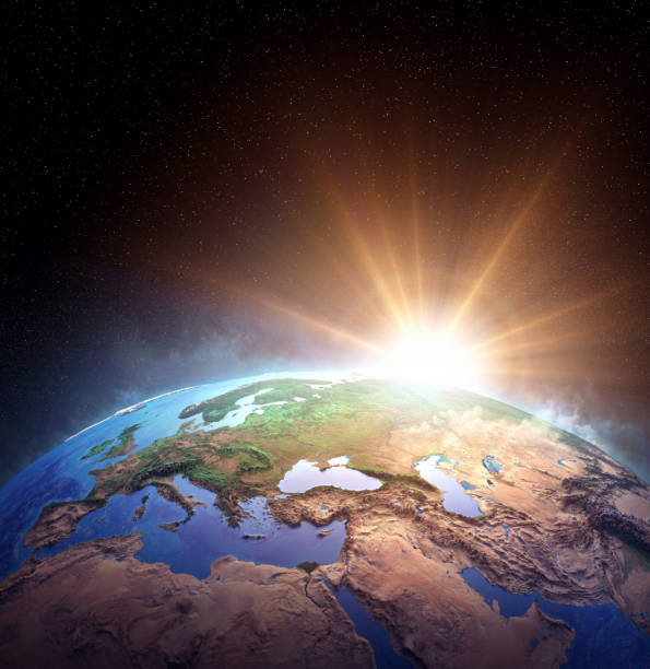 istock Planet Earth from space, sun shining on the horizon 1314526416