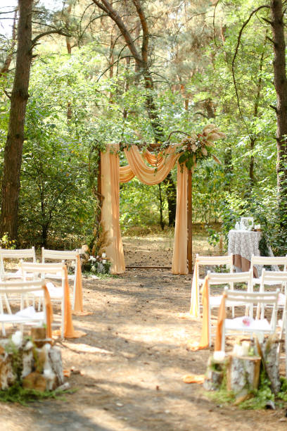 istock Yellow wedding altar and white chairs in garden 1314530606