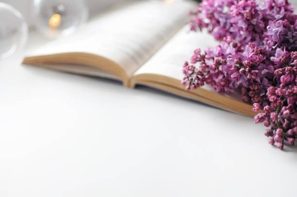 istock Banner with opened book and lilac flowers composition. Romantic atmosphere. 1314530622