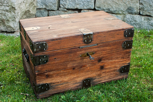 Old wood chest filled with Pirate Treasure. Nice texture and detail in the wood & Treasure.