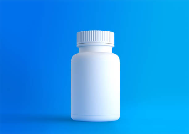 istock White pills bottle on blue background with copy space 1314537179