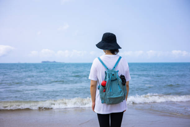 istock Young woman watching the sea 1314537245