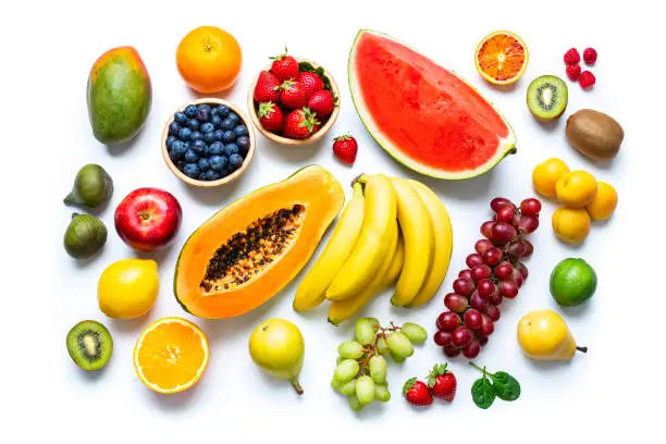 Photo of Multicolored fresh fruits on white background