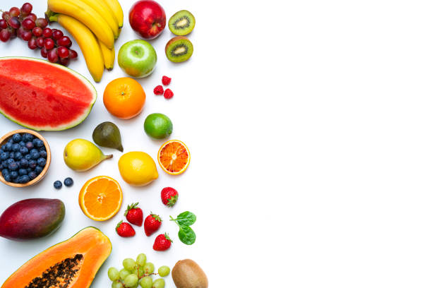 istock Multicolored fruits border on white background 1314537820