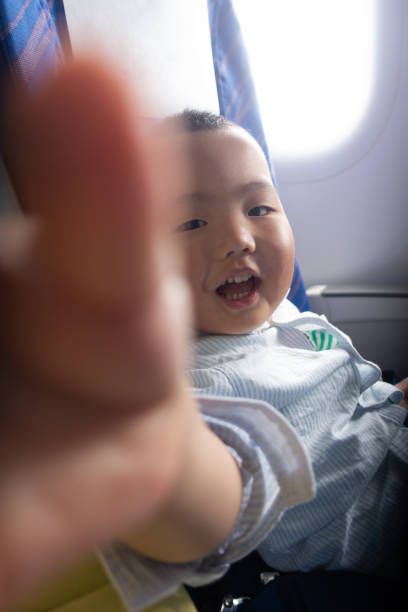 istock Baby Boy In Airplane 1314537871