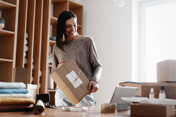 istock Indian mixed-race female seller using tablet checking ecommerce clothing store orders 1314537881