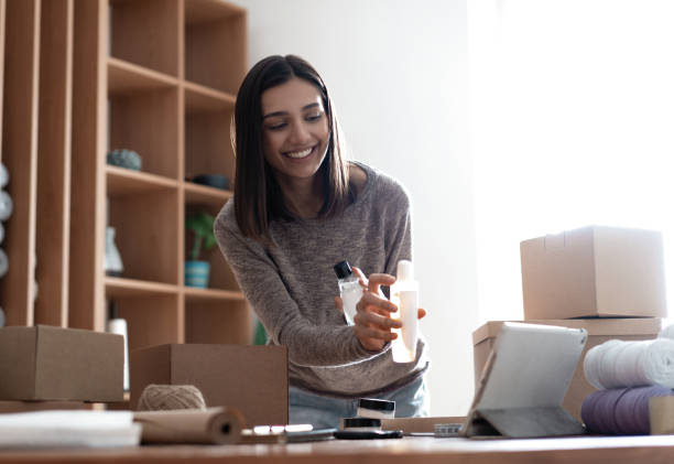istock Indian mixed-race female seller using tablet checking ecommerce clothing store orders 1314538454