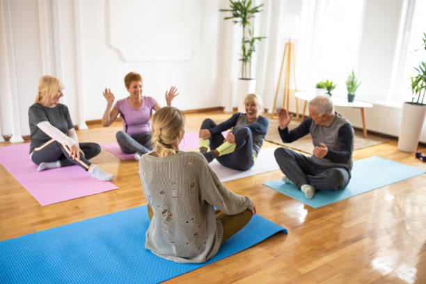 istock Senior people talking and having fun with yoga instructor after yoga class 1314538844