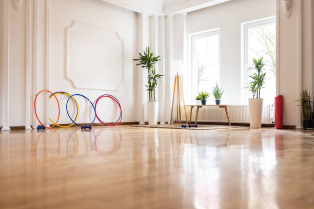Empty, bright space for exercising Empty space for exercising with dumbbells and plastic hoops in it exercise room stock pictures, royalty-free photos & images