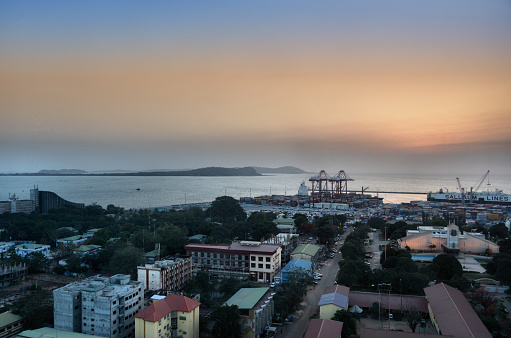 Conakry, Guinea: downtown district cityscape on Tombo island and the Los Islands in the background, Kassa, Tamara and Rooma islands - looking west along 5th avenue - Presidential Palace, port and to the left the Grand Hotel de L'Independance (Hotel de France).