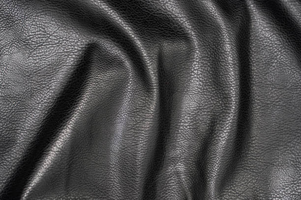 istock photo black leather texture close up 1314540525