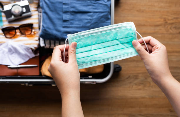 Protect yourself with mask in coronavirus,covid-19 outbreak.body health care.summer, travel Protect yourself with mask in coronavirus,covid-19 outbreak.body health care.summer, travel on reopen country priority baggage tag stock pictures, royalty-free photos & images