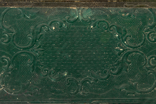 Ancient, green book cover with decoration texture background