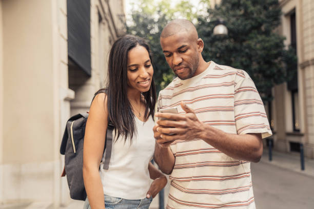 istock Couple in Barcelona walking with luggage 1314542678