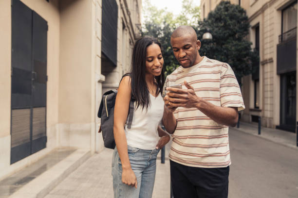 istock Couple in Barcelona walking with luggage 1314542685