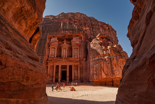 Facade of the treasury in the ancient city of Petra viewed from the canyon the Siq