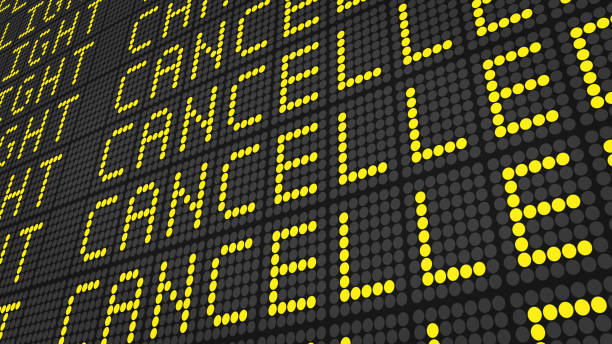 Flight cancelled text on airport departure board . Flight cancelled text on airport departure board . cancelled stock pictures, royalty-free photos & images