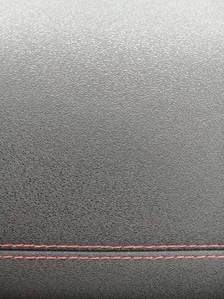 istock Car leather - black background. Interior of a modern car 1314545047