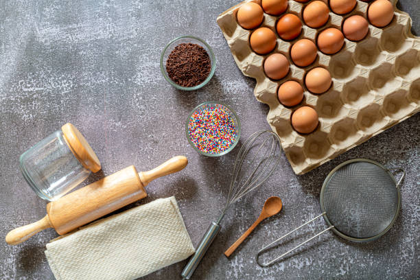 istock Baking ingredients for making cake, pastry or sweet bread on textured blue background. Cooking ingredients top view 1314546330