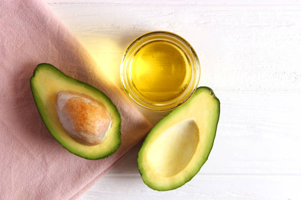 istock Avocado and avocado oil close up on the table 1314546360