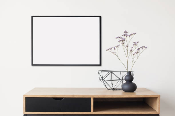 istock Blank picture frame on a wall. Artwork mock-up in interior design 1314546600