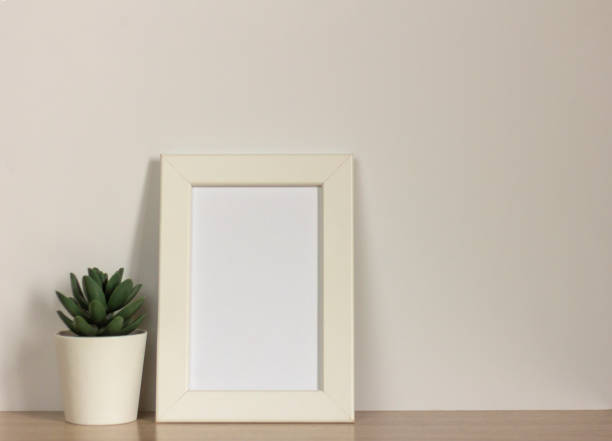 istock An empty photo frame on a table or shelf with a copy of the space. 1314547488