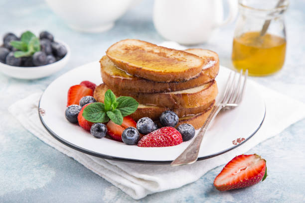 istock stack of french toasts with fresh berries and honey for breakfast 1314547713