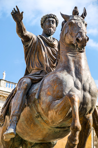 A detailed view of the bronze copy of the equestrian statue of the Emperor Marcus Aurelius, located in the center of Piazza del Campidoglio (Capitoline Square), on the Capitoline Hill, in the heart of Rome. The original statue of Marcus Aurelius is kept inside the Palazzo dei Conservatori nearby. The fortune of this perfectly preserved Roman equestrian statue is due to the fact that for centuries the figure of the statue was considered to be Constantine, the first Christian emperor. Image in High Definition format.