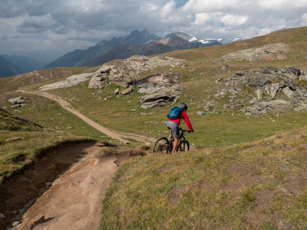 istock Man mountain biker rides along trail in Summer 1314548358