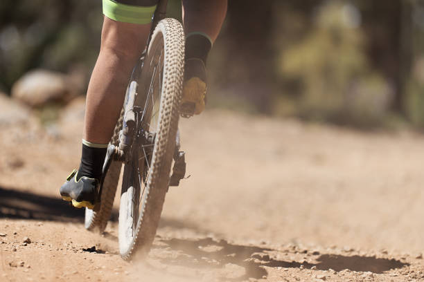 istock Mountain biker riding on bike singletrack trail 1314549241