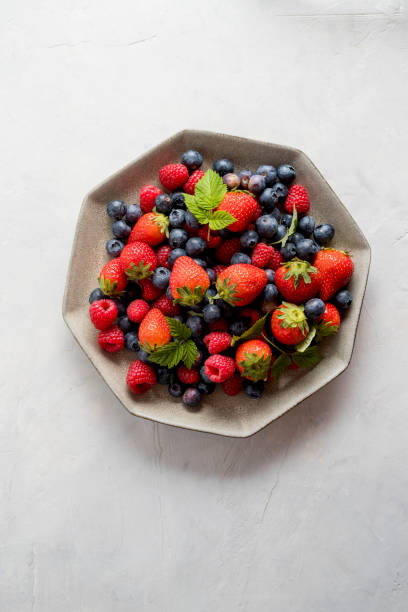 istock Isolated plate of blueberries, strawberries, raspberries. 1314549565