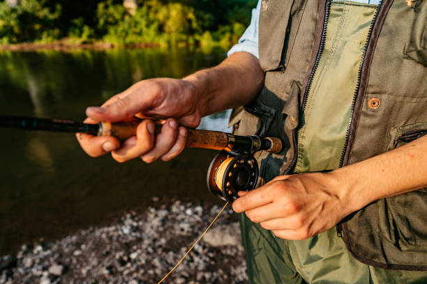 istock Man with a spinning fishing on the river 1314549864