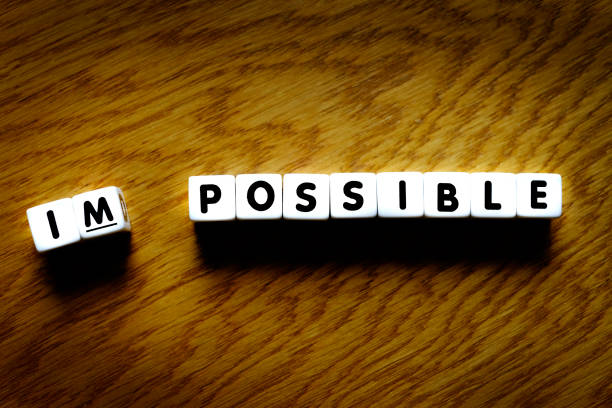 istock Impossible to possible words spelled out representing achievement and success through attitude and work 1314550242
