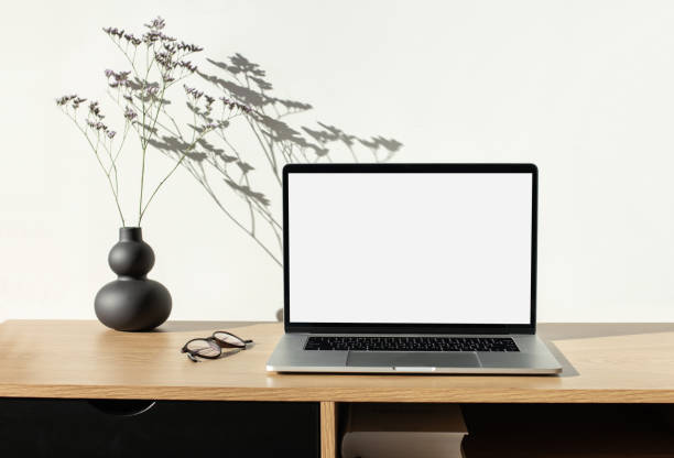 istock Laptop with blank screen mock-up at home desk. Place of work 1314550816
