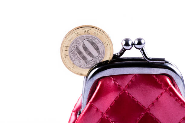 10 yuan coin and red miniature wallet on white background