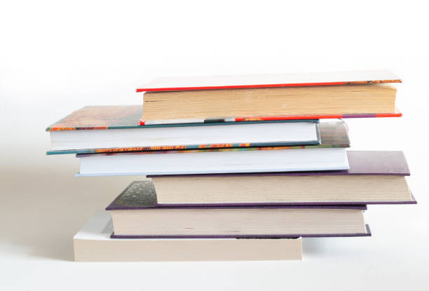 Stack of hardcover books on white background