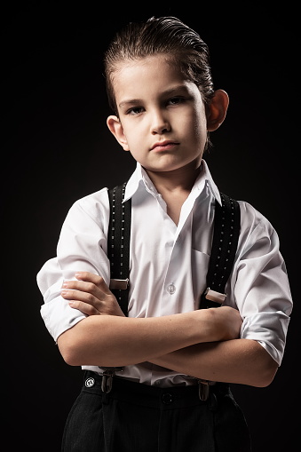 Boy in a gangster on a black background