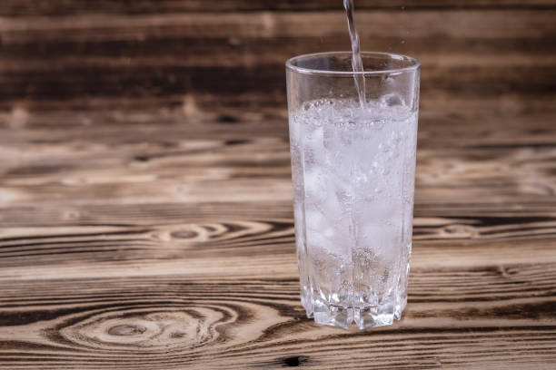 istock fresh seltzer water is poured into a glass with ice. 1314556299