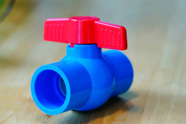 Close-up PVC Ball valve on wooden table for pipe-tube