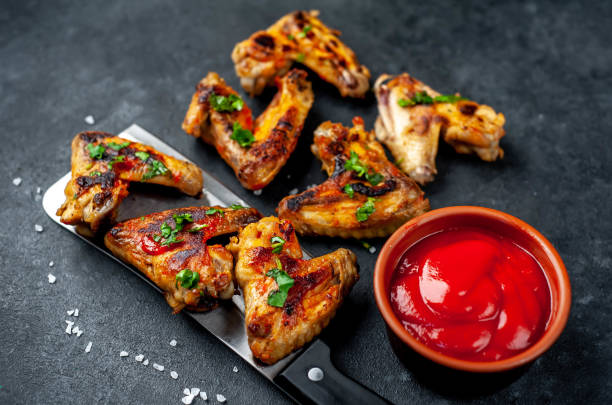 istock grilled chicken wings on a meat knife on a stone background with copy space for your text 1314558709