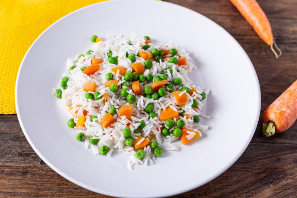 Basmati rice with carrots and green peas.