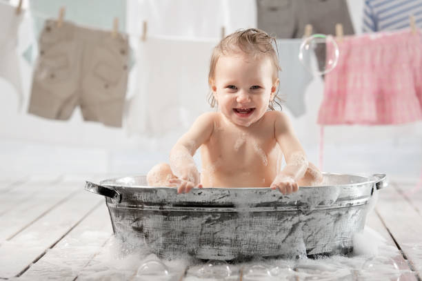 istock Bathing baby in the laundry room 1314562033