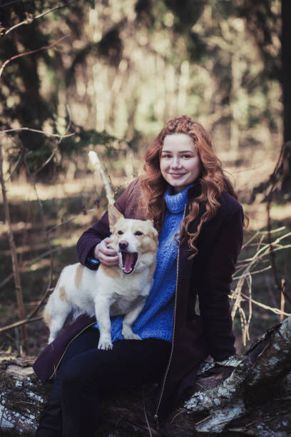 istock girl with dog in park 1314562996