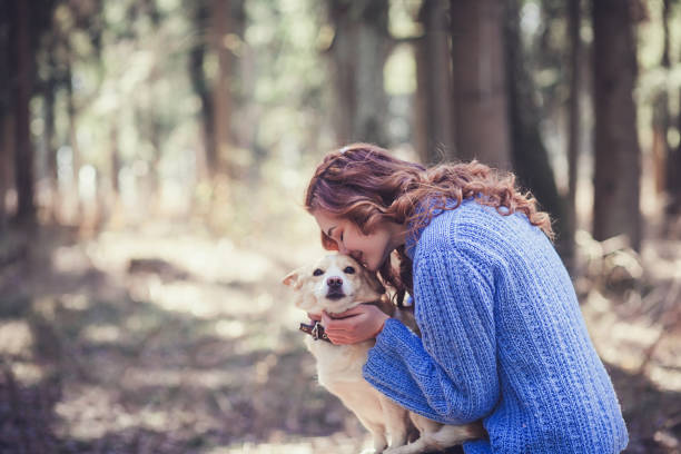 istock Little girl playing with her dog 1314563059