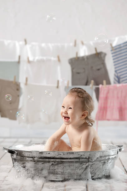 istock Bathing baby in the laundry room 1314563284