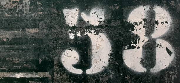 istock Stencil fifty eight, spray stencil on metal, white numbers 1314567755