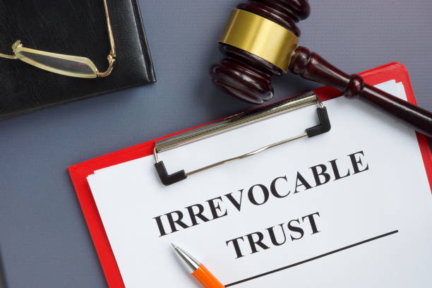 istock Irrevocable trust document on the clipboard and gavel. 1314568095